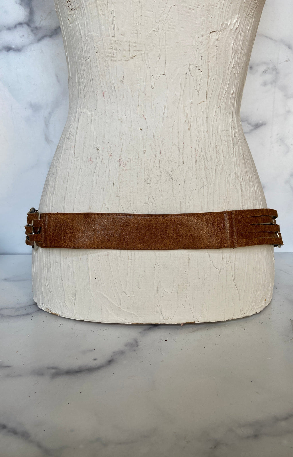 Brown leather belt with metal circle