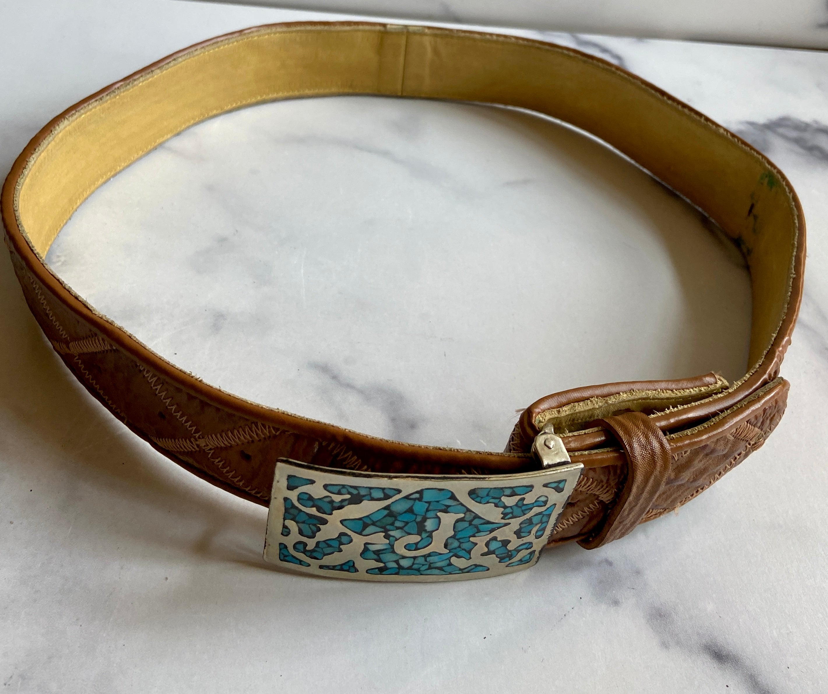 Turquoise Belt Buckle in a vintage leather tooled belt